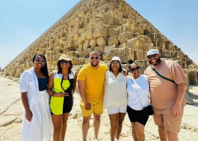 A group of tourists in front of Giza Pyramids