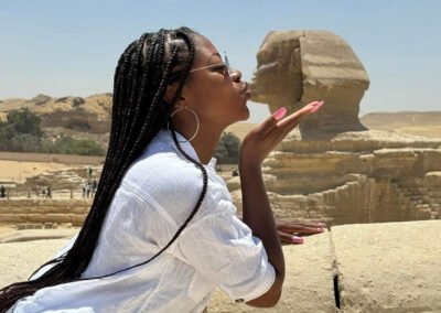 Young lady kissing Sphinx